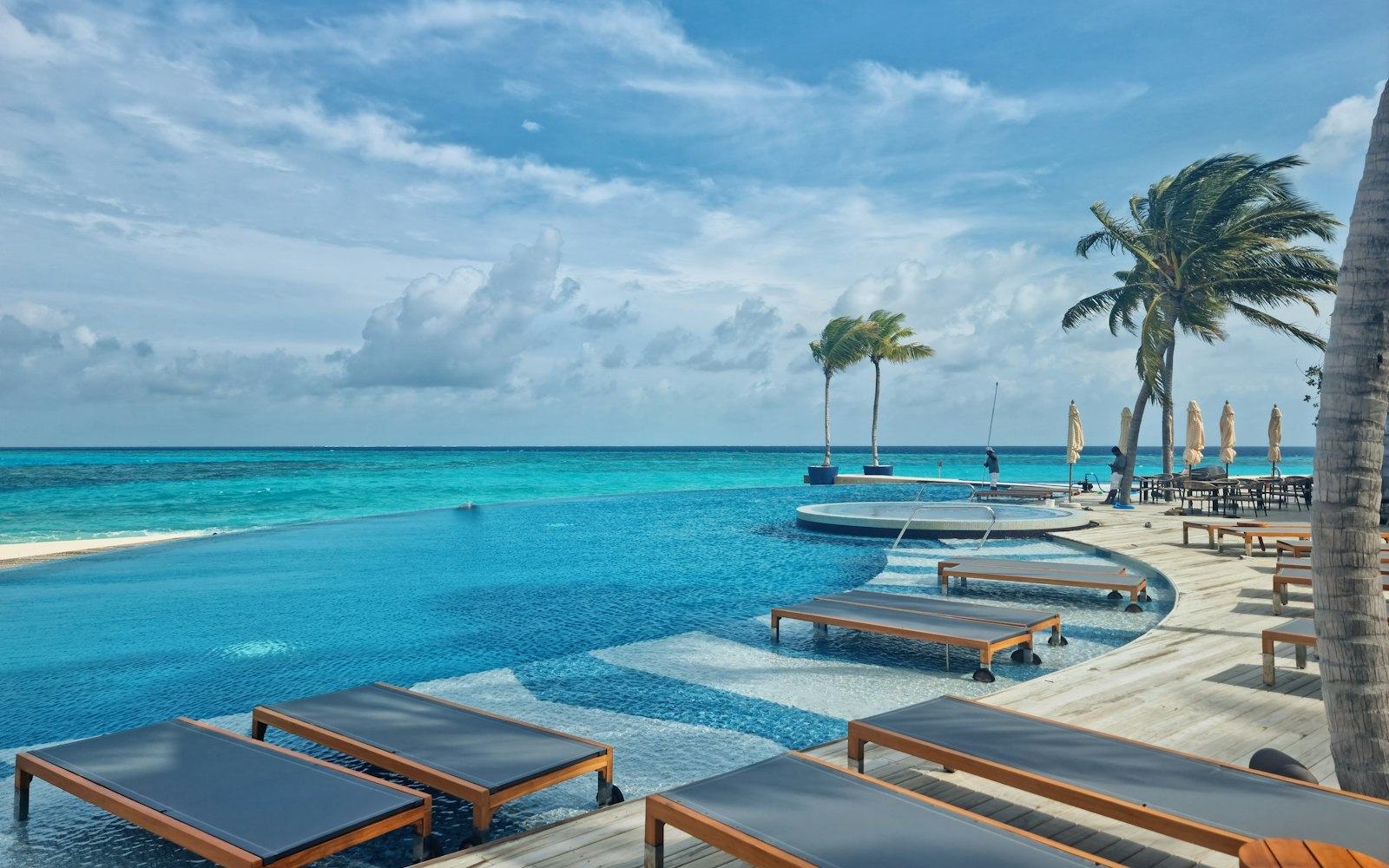 A resort pool overlooking the sea